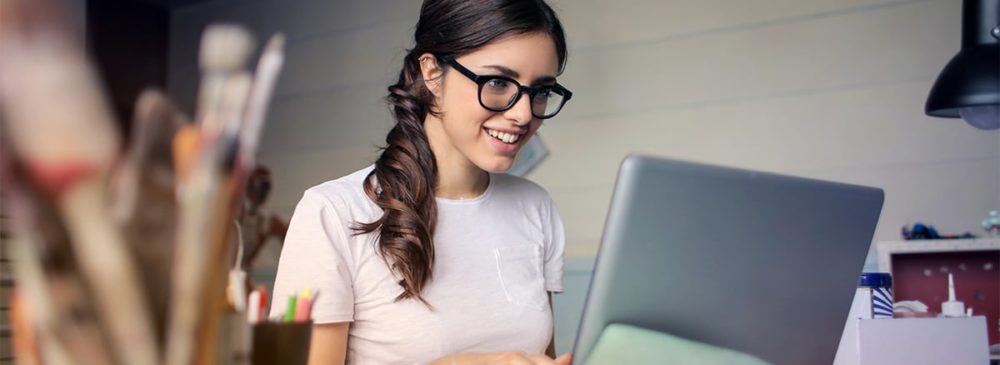 women-smiling-at-computer-blurred